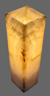 Decorative lamp with a natural wood grain pattern on a plain background